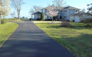 after residential asphalt driveway paving